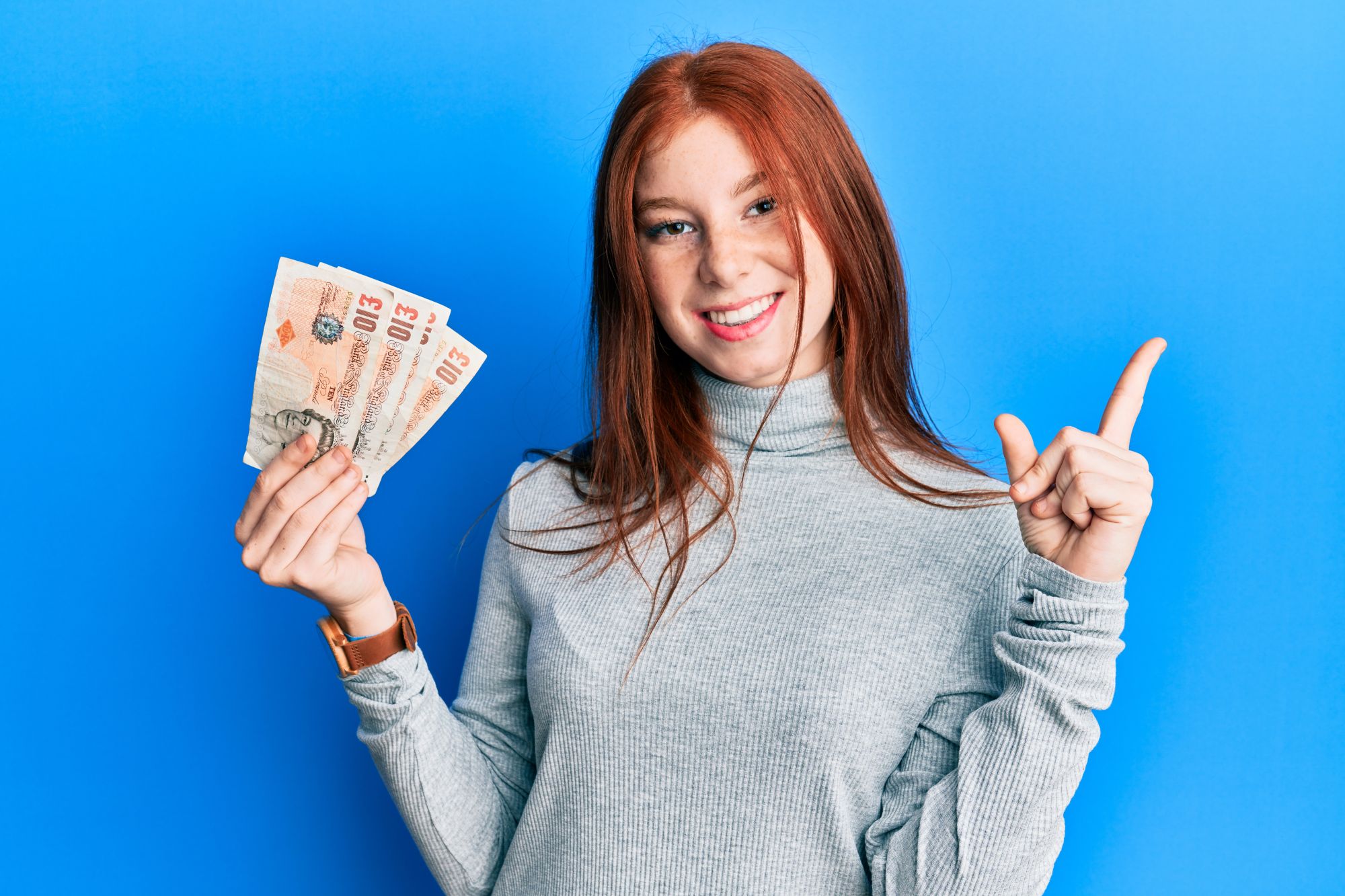 Woman holding money